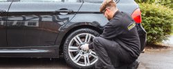 Mobile Tyres 2 U mechanic changing car tyre on BMW